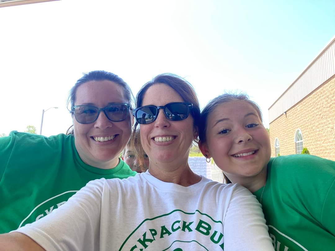 Amanda, Jacque and a friend helping pack backpacks