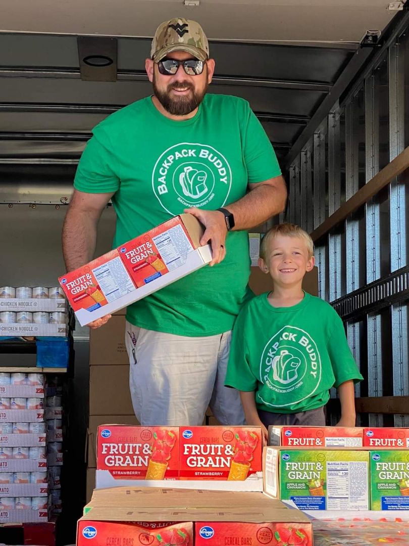 Some volunteers unload a truck of supplies