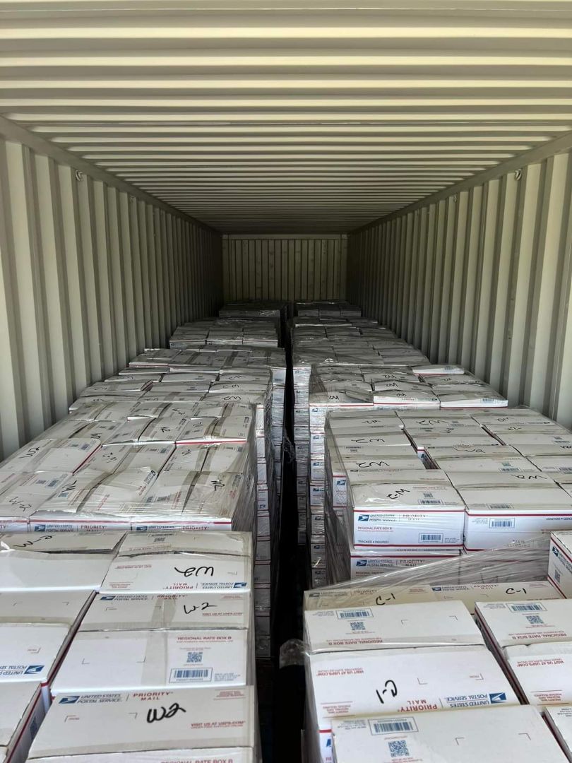 A trailer full of packed boxes ready for local children