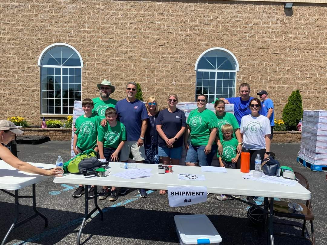 A group of volunteers who helped with backpacks