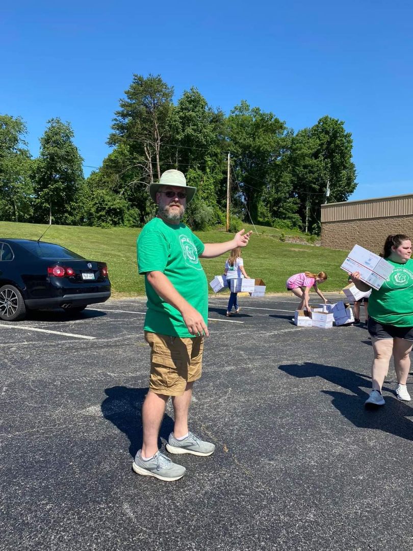 A volunteer directing traffic