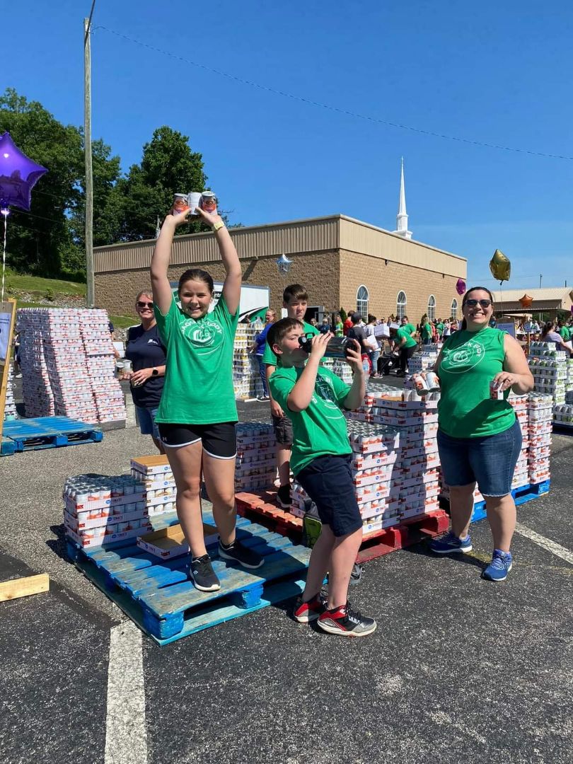 Adults and volunteers having fun while they work