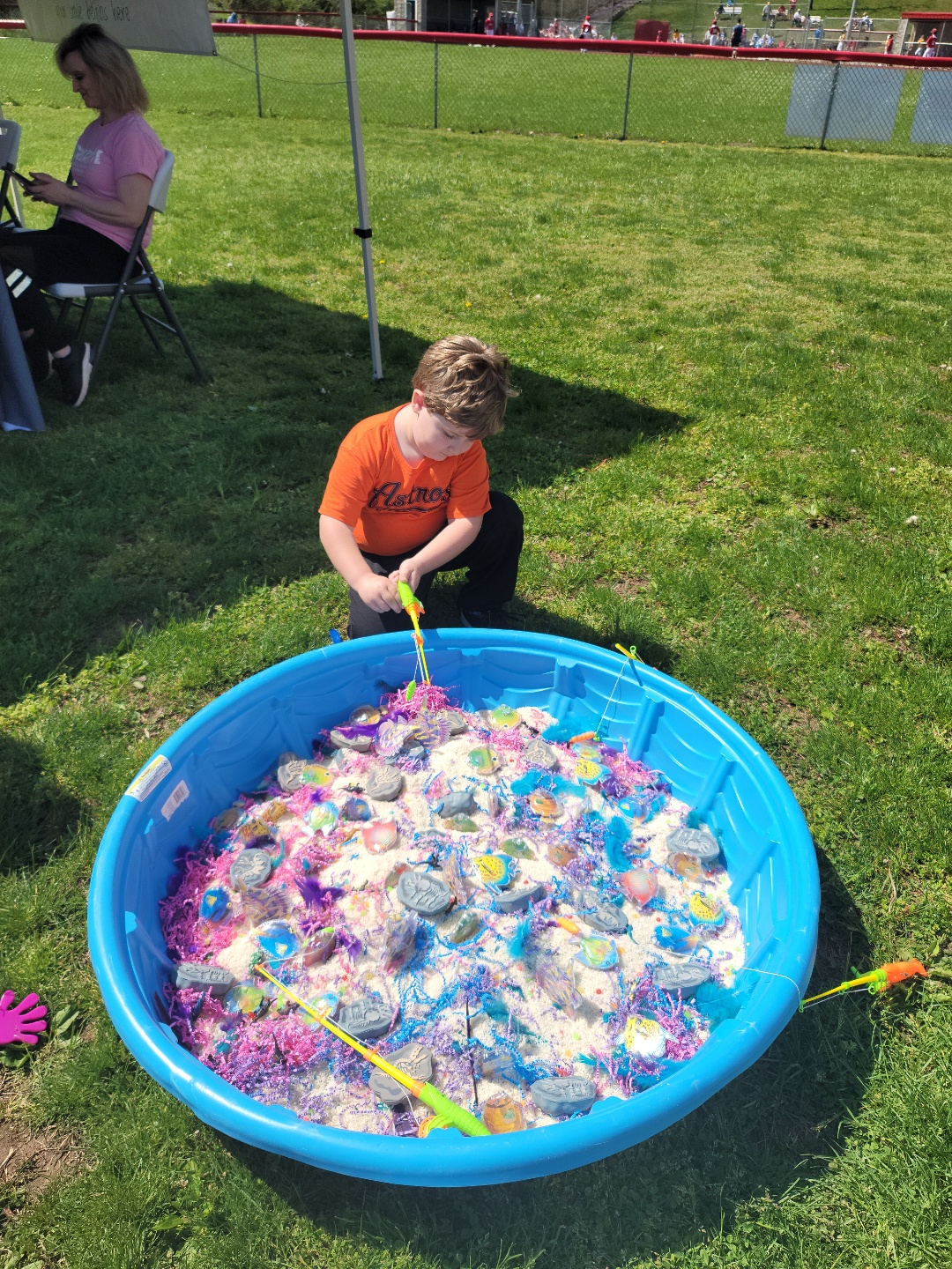 A child testing out the fishing pond game